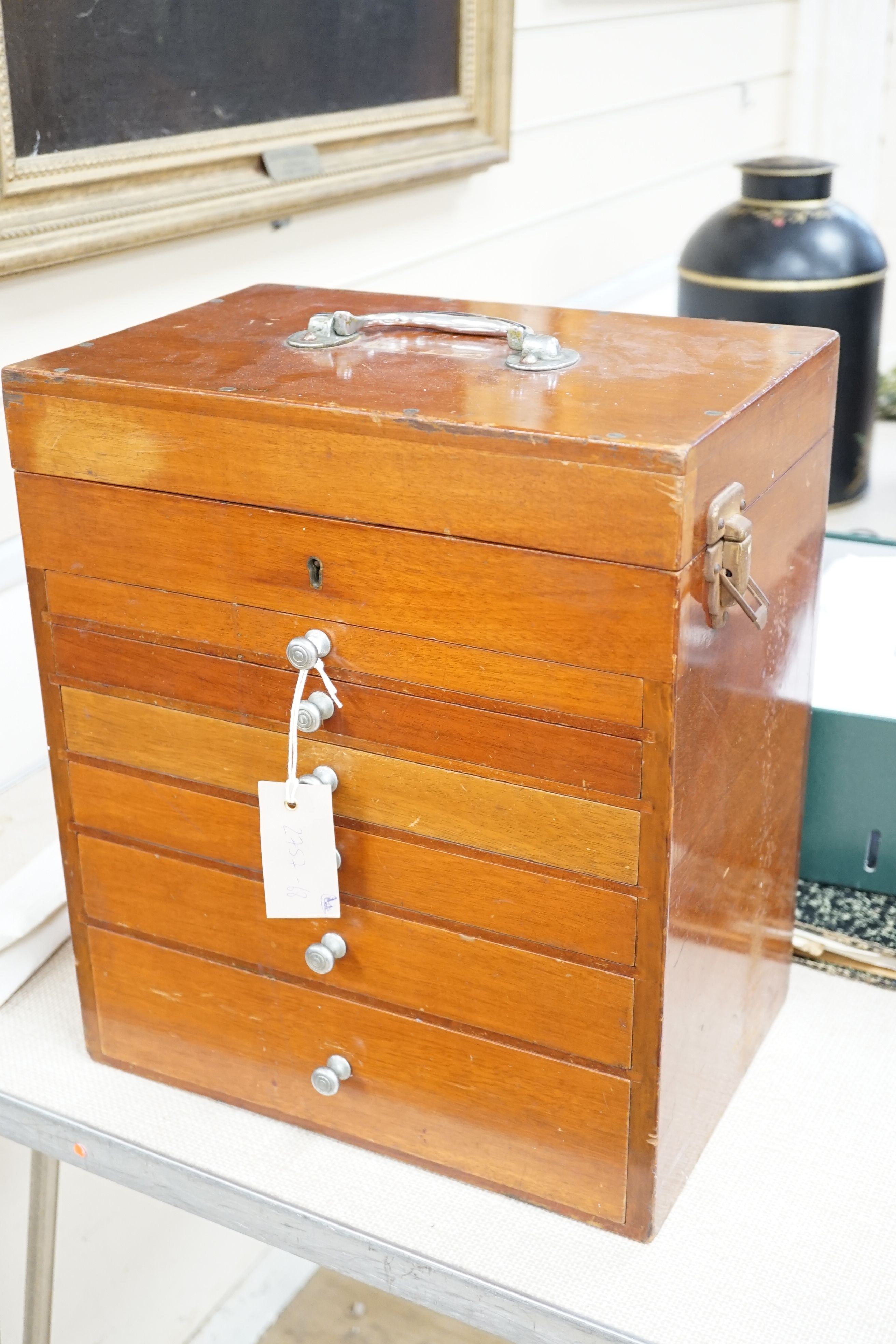 A mid 20th century mahogany dentist’s cabinets and accessories, 39.5 x 34 cms wide.